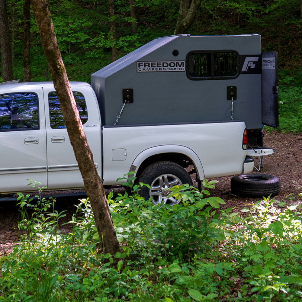 Truck mounting kit attaching a Freedom Camper to the truck bed